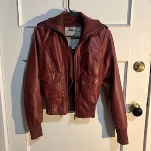 A burgundy leather jacket.